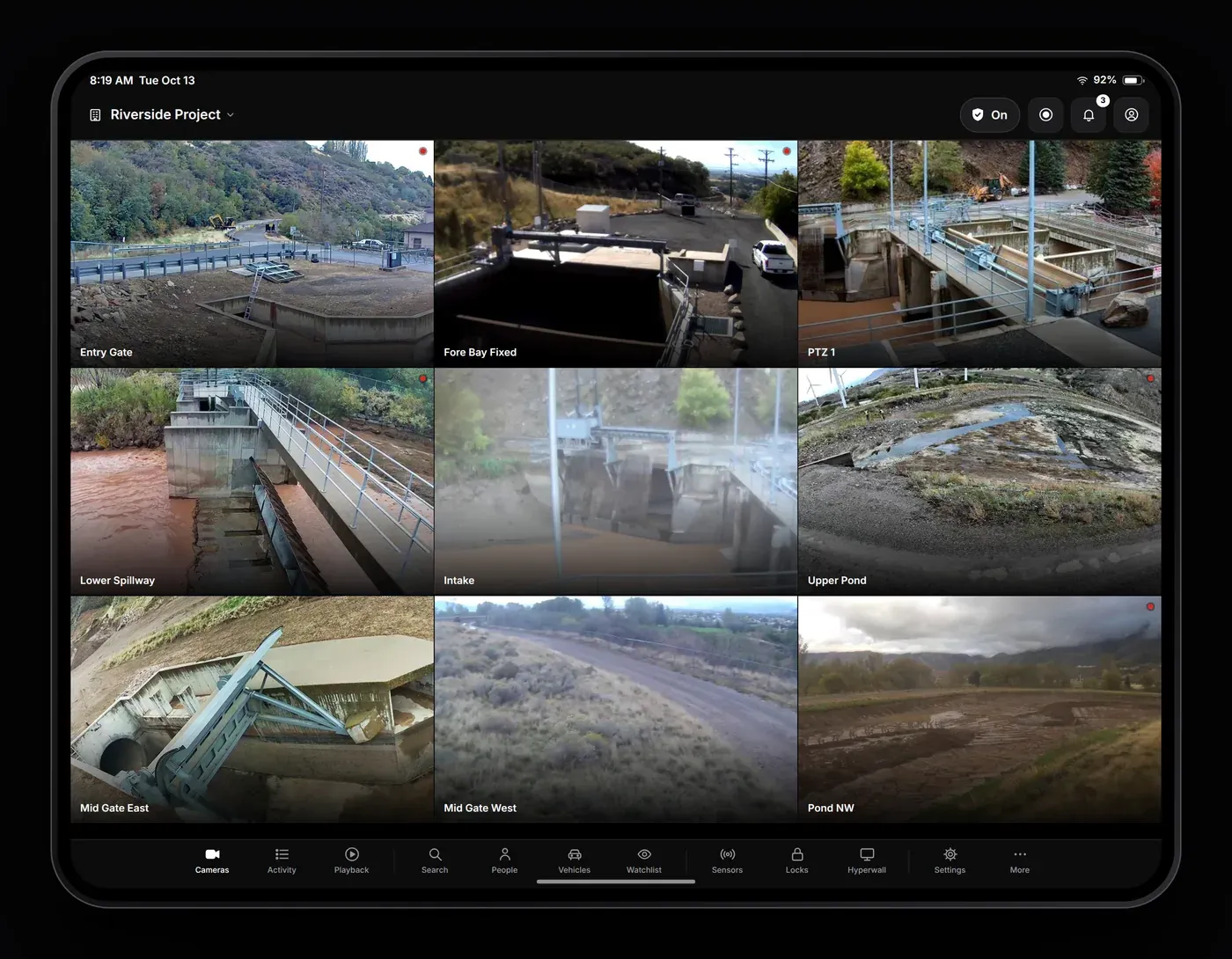 AXN Pro VMS on iPad showing a grid of nine jobsite cameras