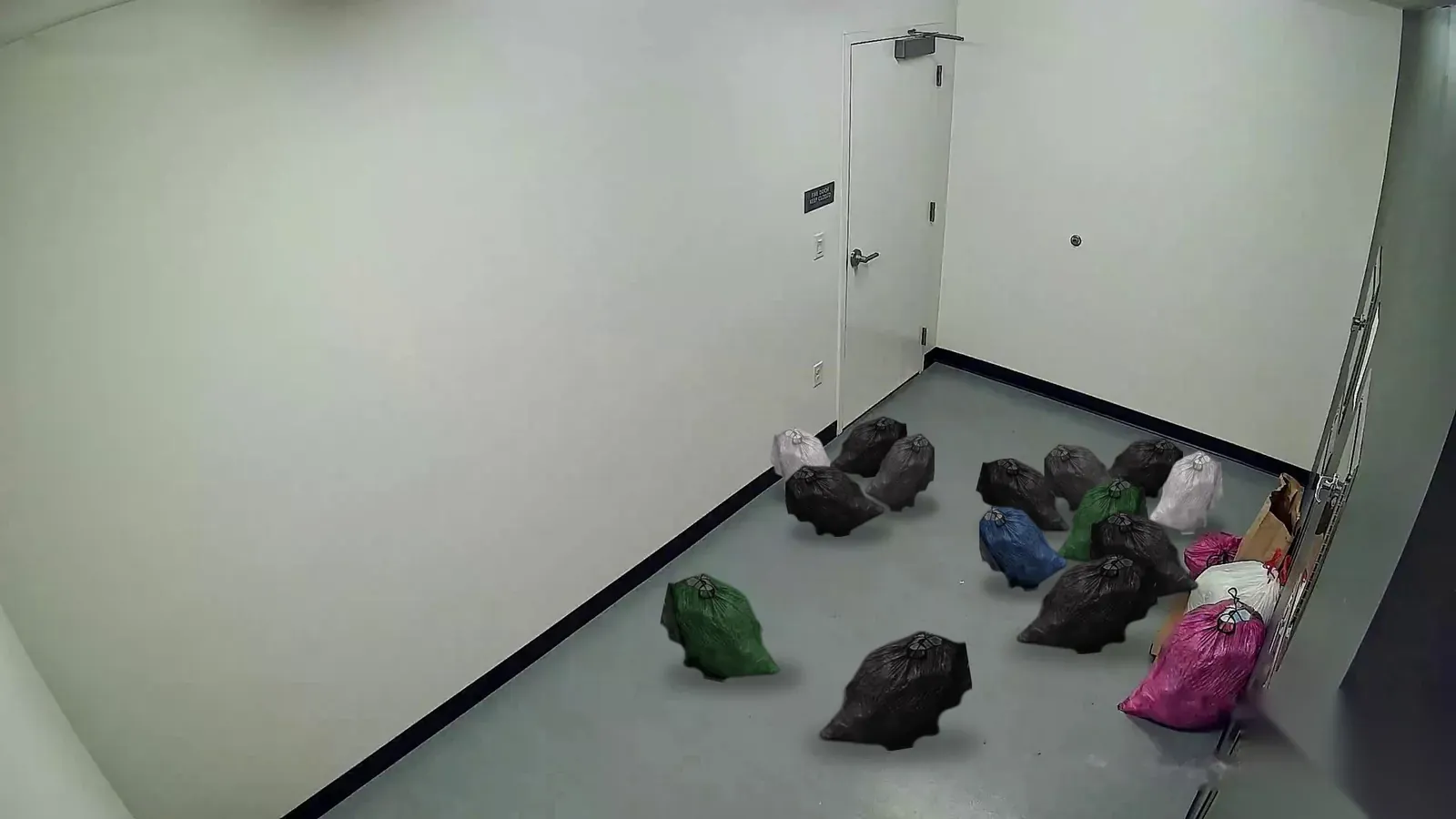 Trash room with bags on the floor